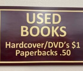 Used Book sign: hardcover/DVD's $1 Paperbacks . 50