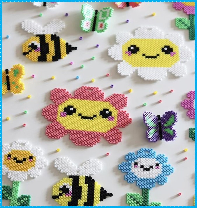 Black and yellow bumble bee, white ad blue flowers, pink and yellow sun and purple butterfly beaded magnets