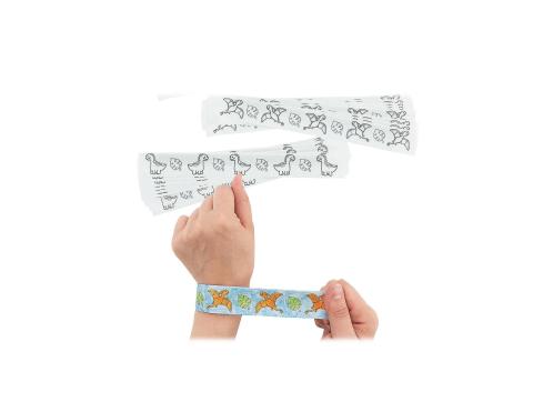 arm and fist showing plastic slap bracelet decorated with dinosaurs