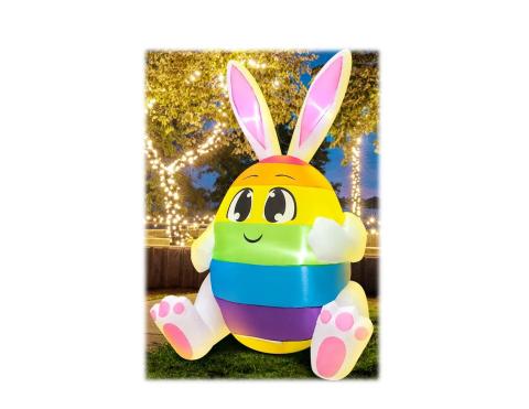 smiling bunny inflatable dressed as a multi color egg 