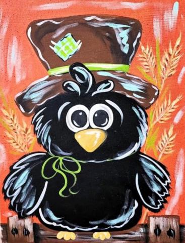 Black crow with scarecrow hat on top of his head. 