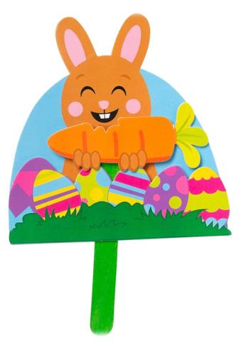 A HAPPY ORANGE BUNNY CRAFT EATING A CARROT SURROUNDED BY COLORFUL EASTER EGGS