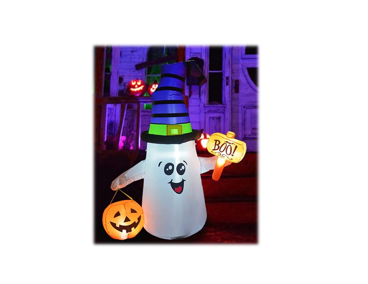 smiling inflatable ghost with black, blue, and green hat. holding boo sign and a jack o lantern