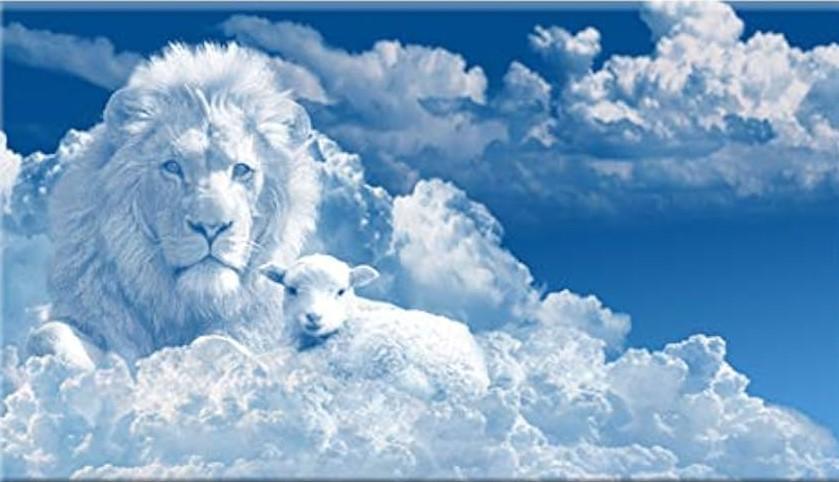 White clouds in blue sky. A lion and a lamb are clouds in the clouds. 